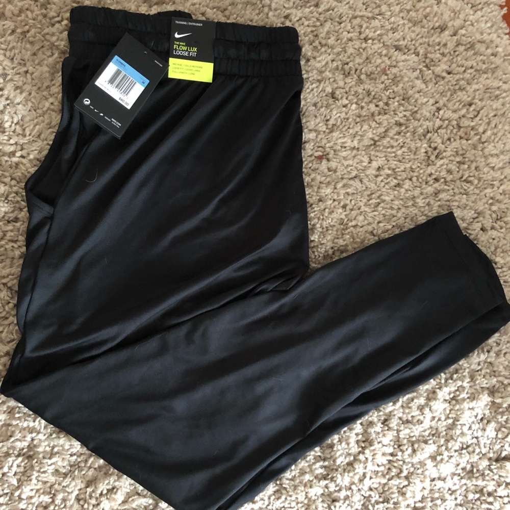 Nike women’s flow lux loose fit pants - NEW w/tags